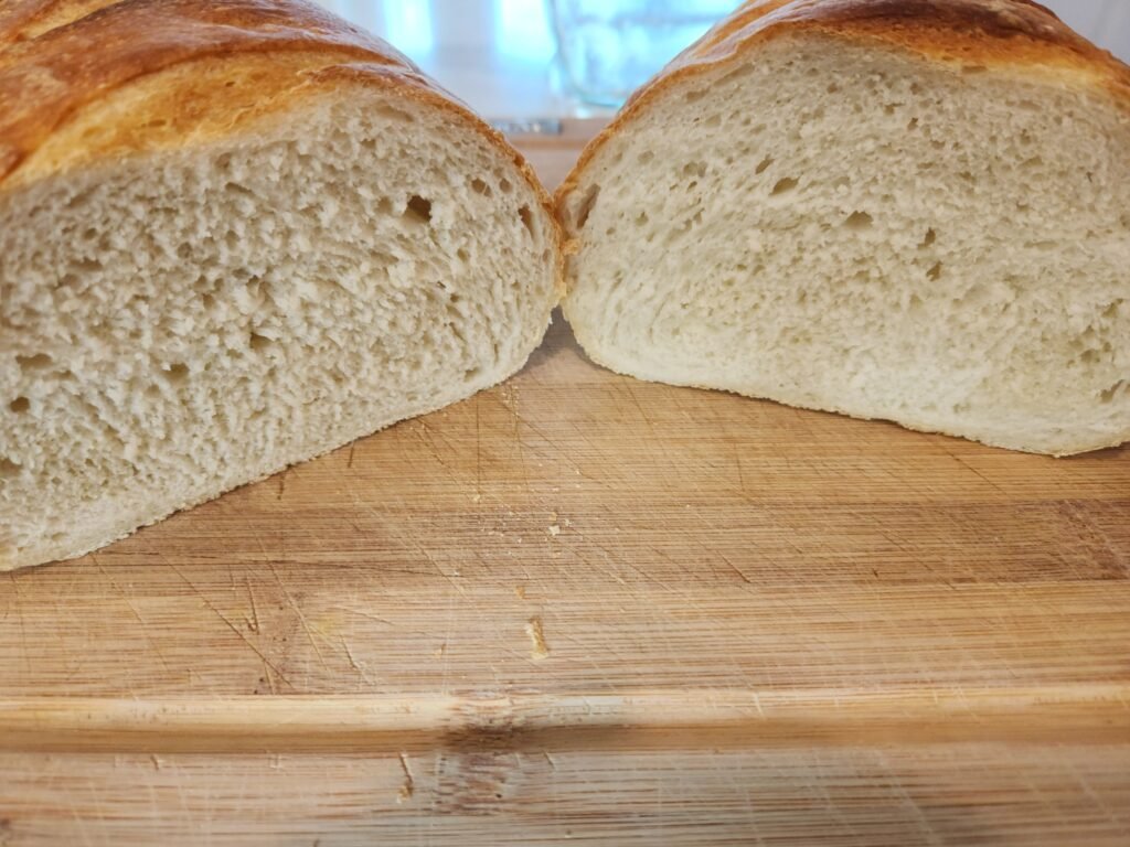 Fresh bread cut open to show soft fluffy interior of the bread.