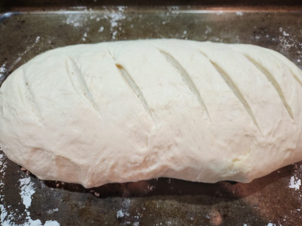 Cut slits in bread dough
