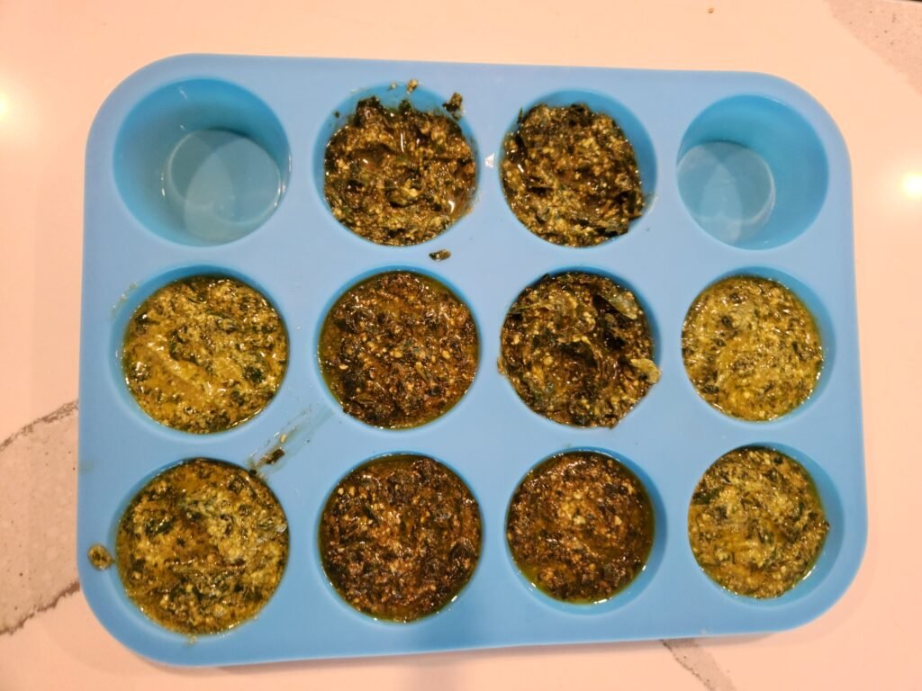 Basil Pesto in muffin tin to be frozen