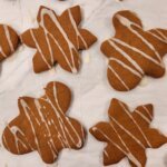 Soft and chewy gingerbread cookies on a holiday tray