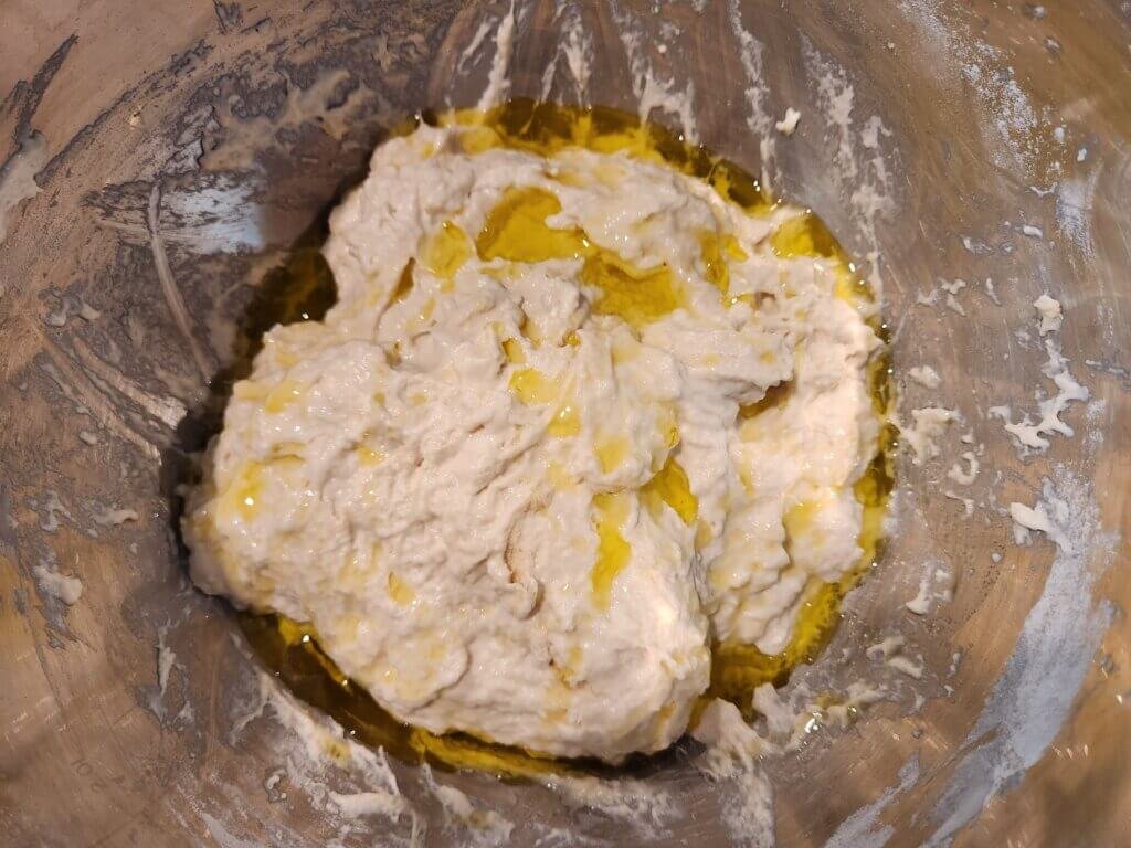 Focaccia bread dough after first mixing with olive oil