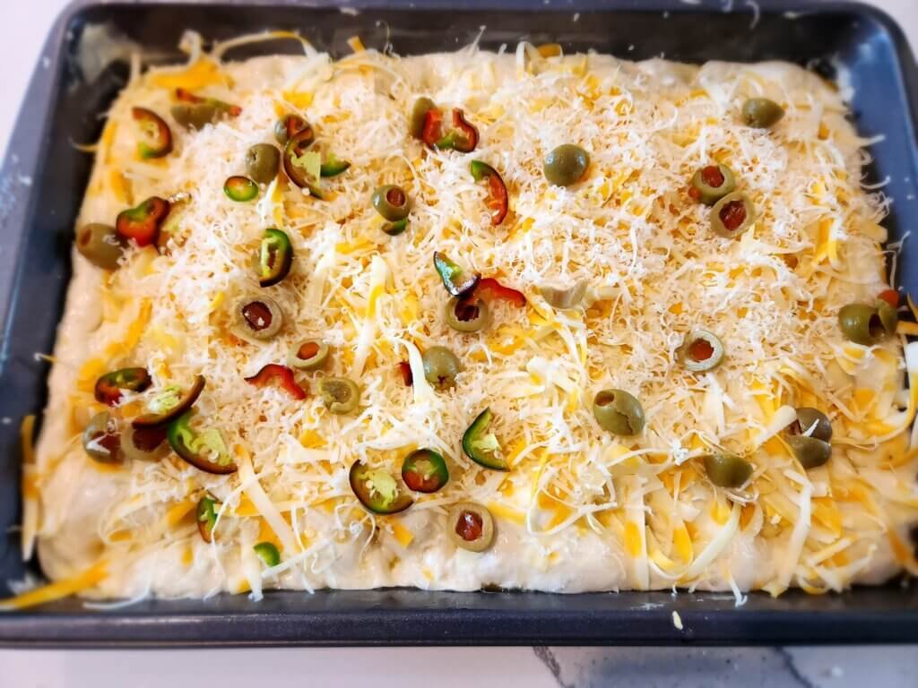 Ingredients added to focaccia bread
