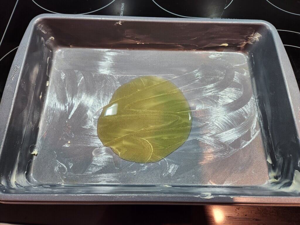 Olive oil added to the middle of a greased 9x13 oven safe dish