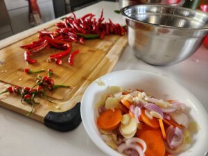 Preparing ingredients for fermented hot pepper sauce