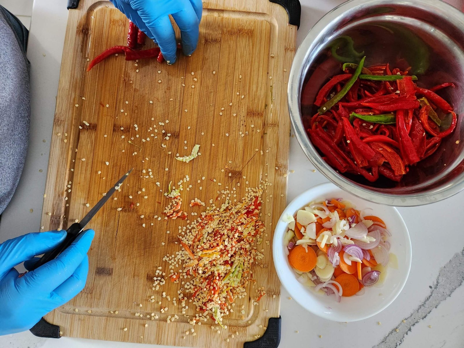 Preparing ingredients for fermented hot pepper sauce.