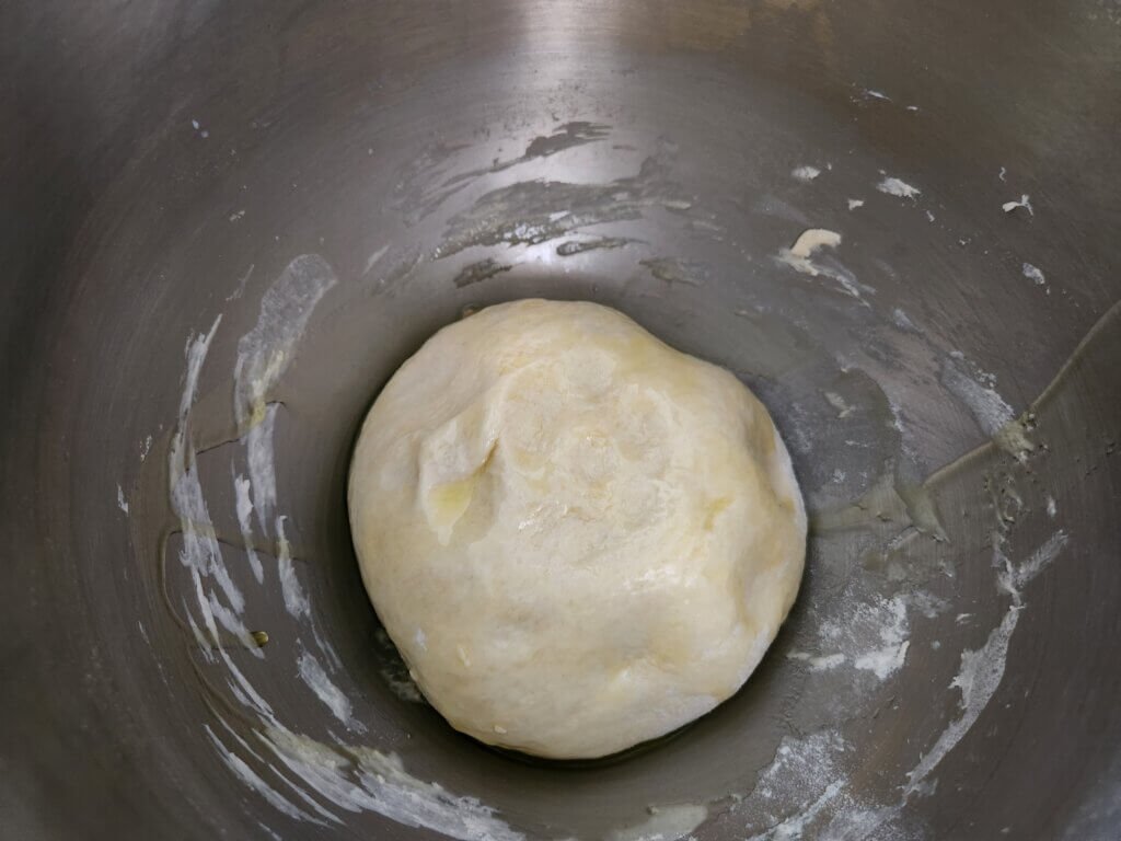 Bread dough in a oiled mixing bowl