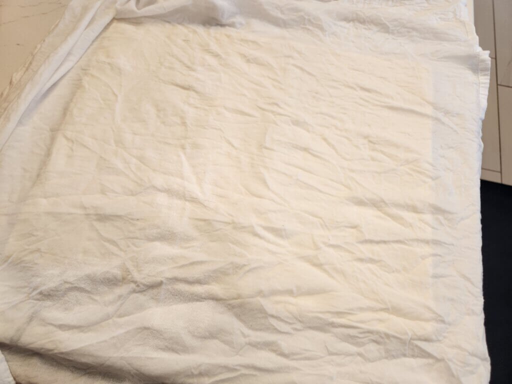 Covering phyllo sheets with a damp cloth