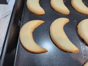 Greek white cookies golden brown around edges fresh out of oven
