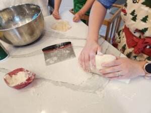 Mother and Daughter kneading dough