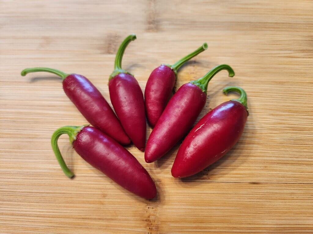 Ripe Jalapeno peppers on a cutting board