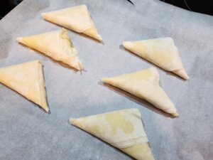 Triopita on baking sheet before baked