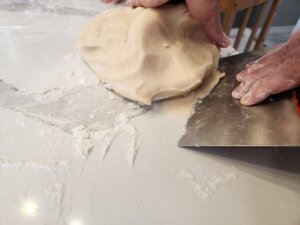 Use Scraper to Get the sticky dough off the counter