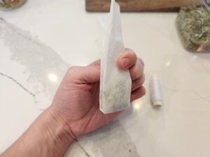 Fold the two ends of the tea bag together