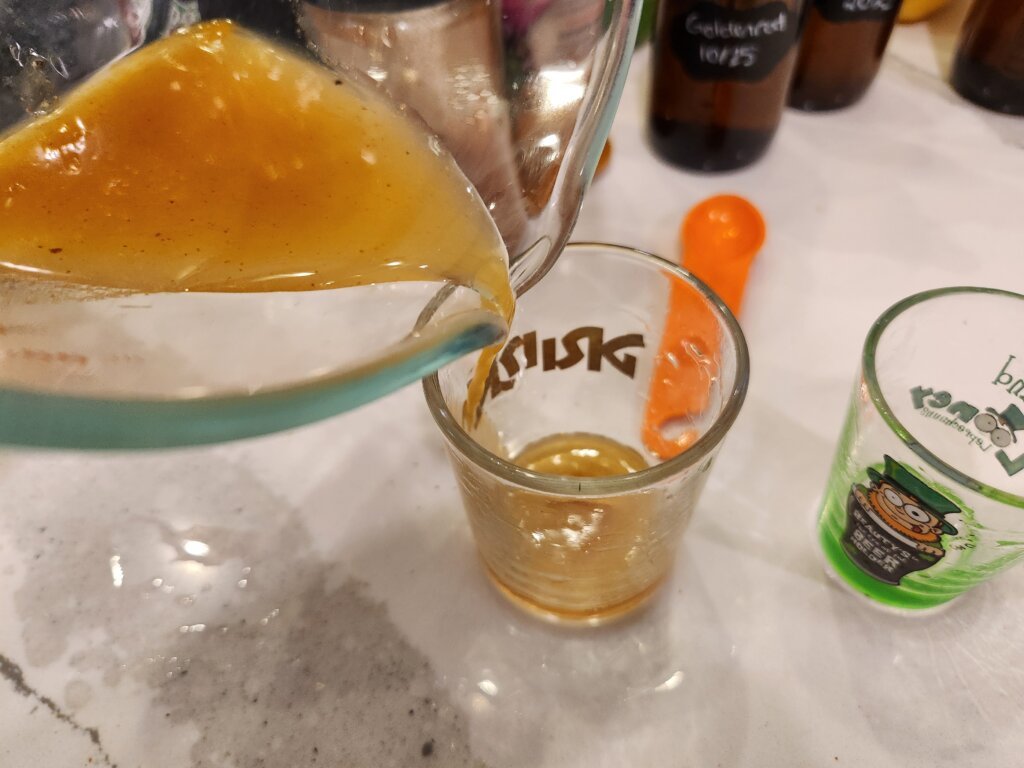 Pouring the Quick Fire Cider Into Shotglass