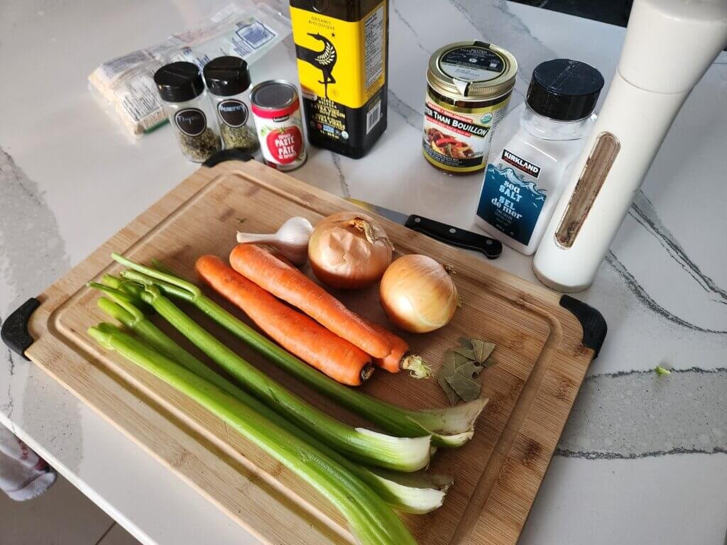 Onions, carrots, celery, garlic, and pearl barley for beef and barley soup