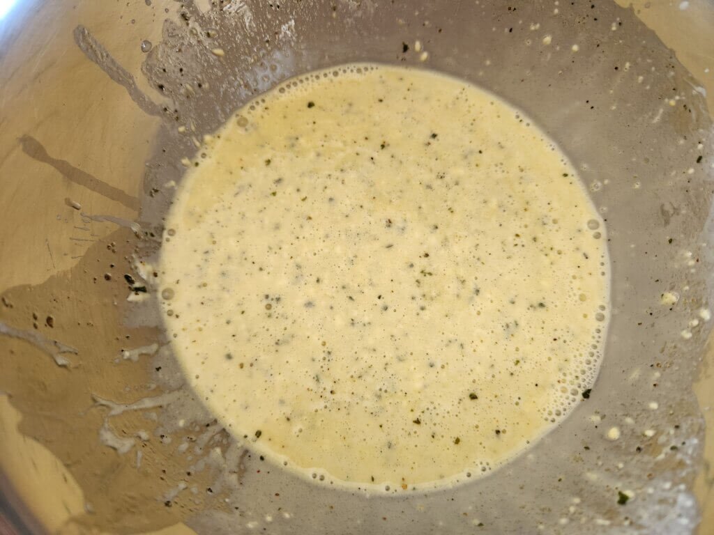 Creamy homemade coleslaw dressing in bowl