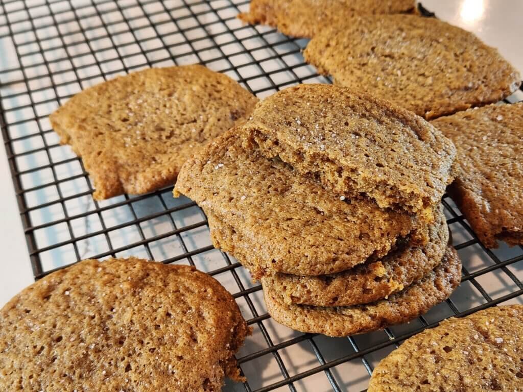 Pumpkin spice cookies on a cooling rack after baking for 15 minutes