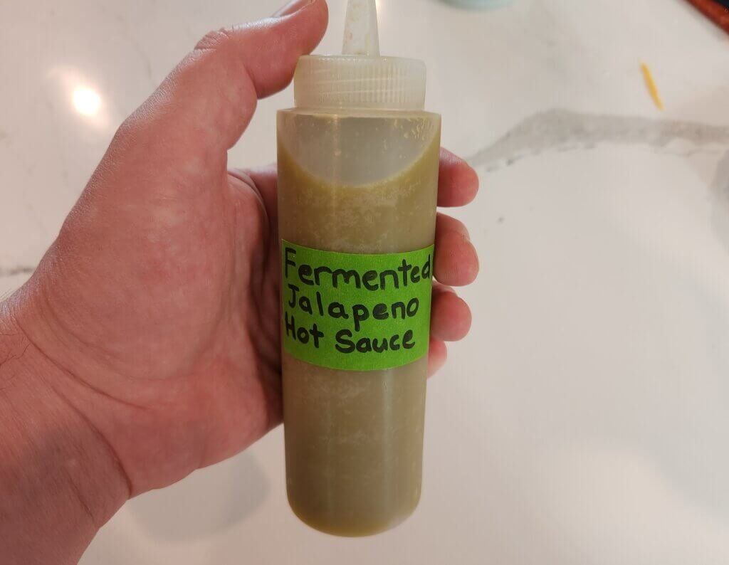 Bottled homemade fermented jalapeño hot sauce