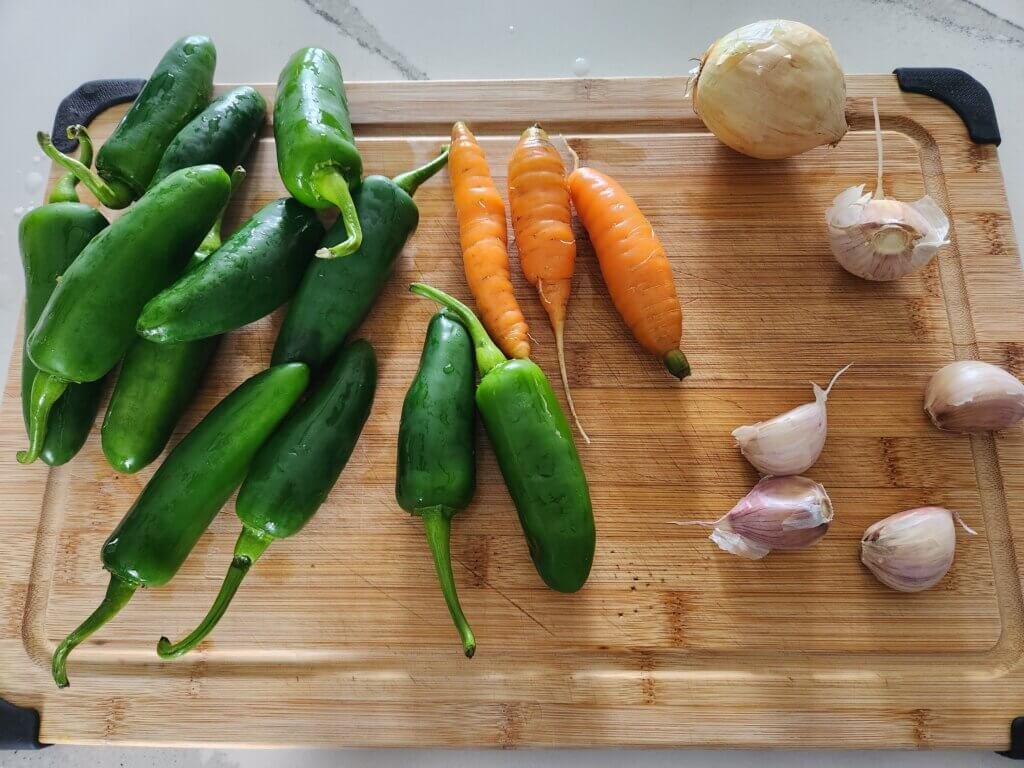 Fresh jalapeños, carrots, onion and garlic for fermented jalapeño hot sauce